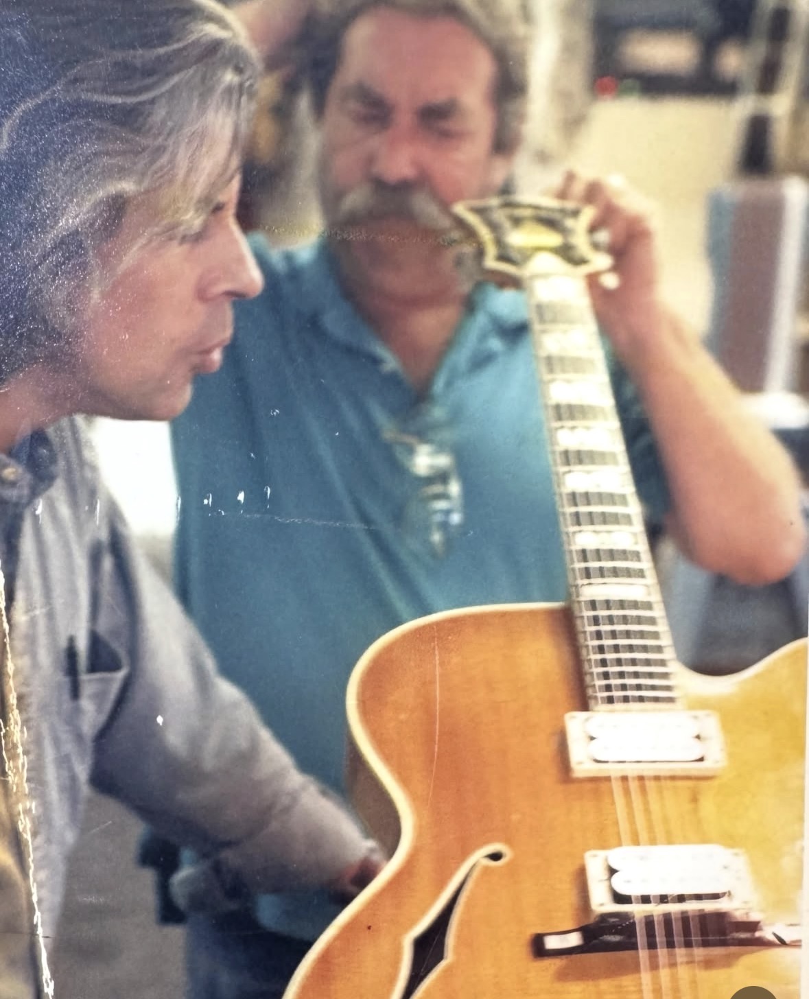 Archival image of guitar craftsmanship at The Guitar Shoppe
